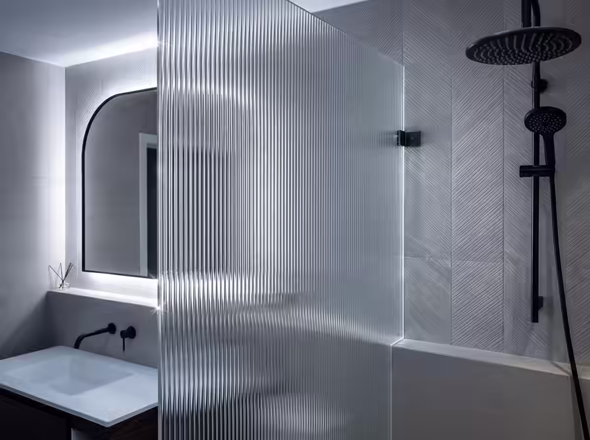 True Frameless Reeded Glass Shower Screen